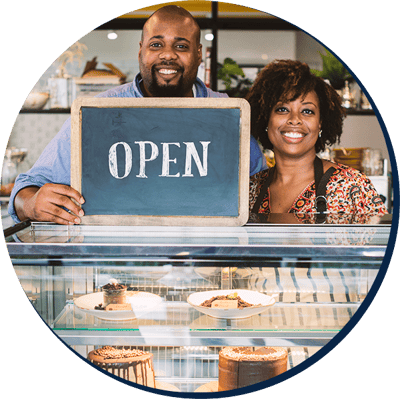 cake-cafe-owners-with-open-sign cake-cafe-owners-with-open-sign